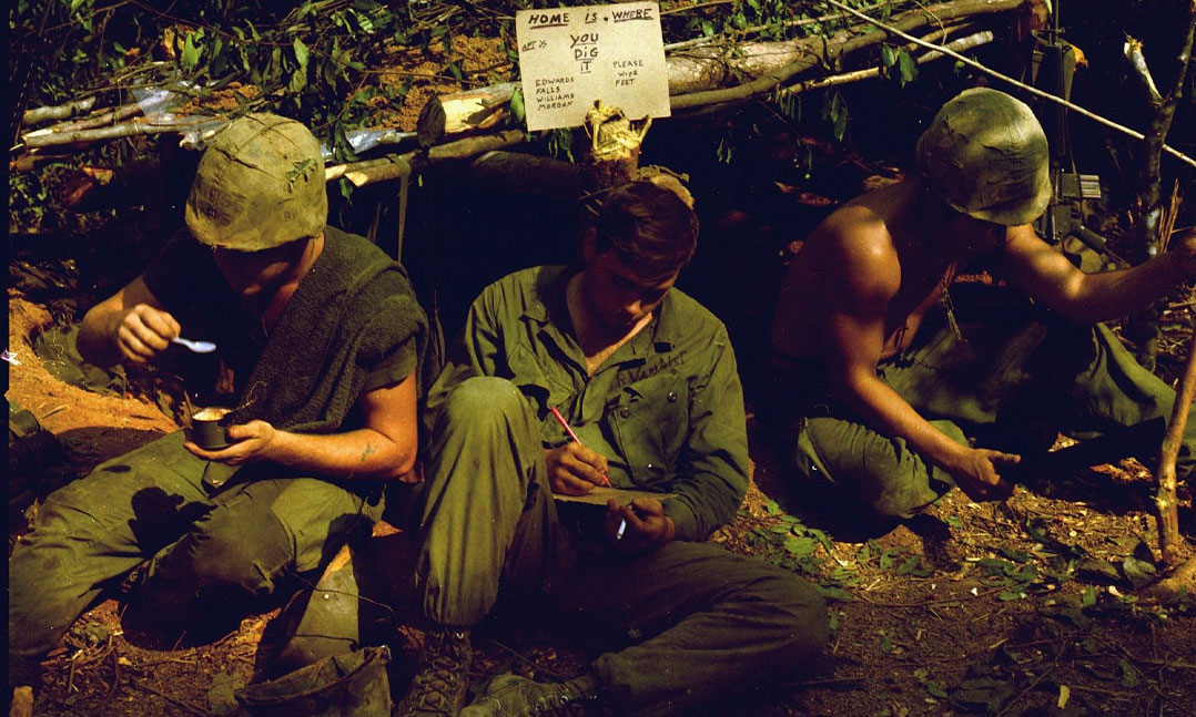 soldiers in front of their foxhole during the Vietnam War