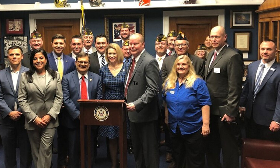 Major Richard Star and his wife Tanya surrounded by VFW and other VSO advocates during a press conference for the Major Richard Star Act