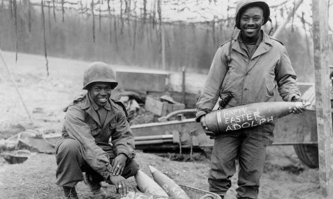 Army Tech. Sgt. William E. Thomas, left, and Army Pfc. Joseph Jackson prepare “Easter eggs” for Adolf Hitler on March 10, 1945, in Germany