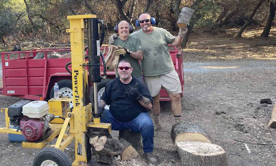 VFW members split wood for their community