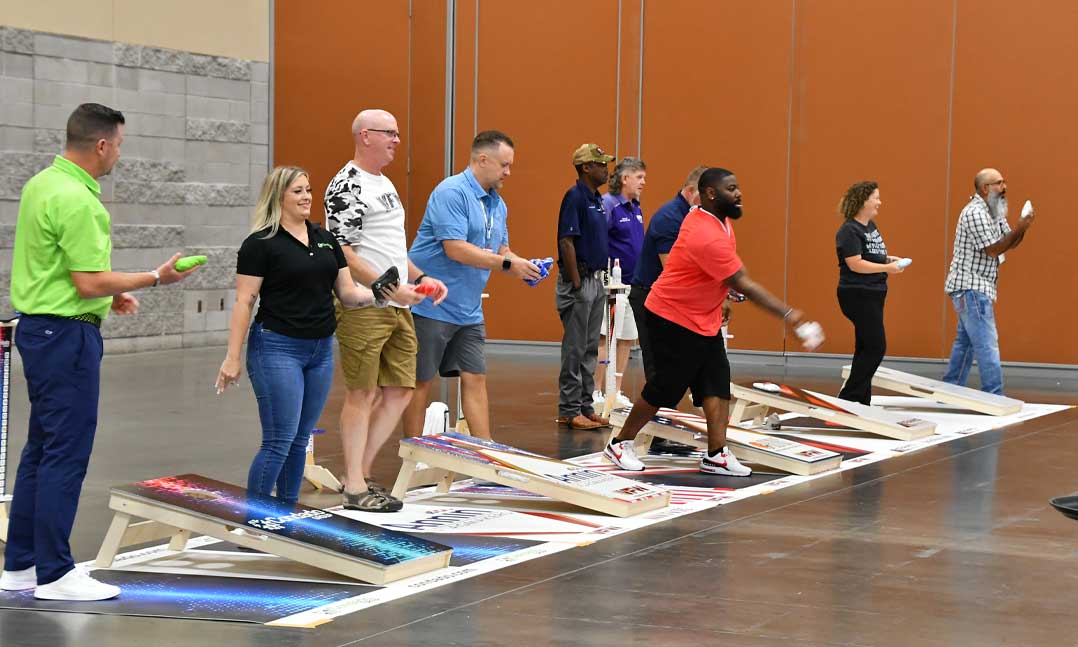 veterans play cornhole during VFW National Convention 2023