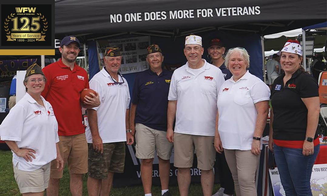 VFW Post 304 members and guests prepare to greet visitors to their booth last September at the Navy-Marine Corps Memorial Stadium