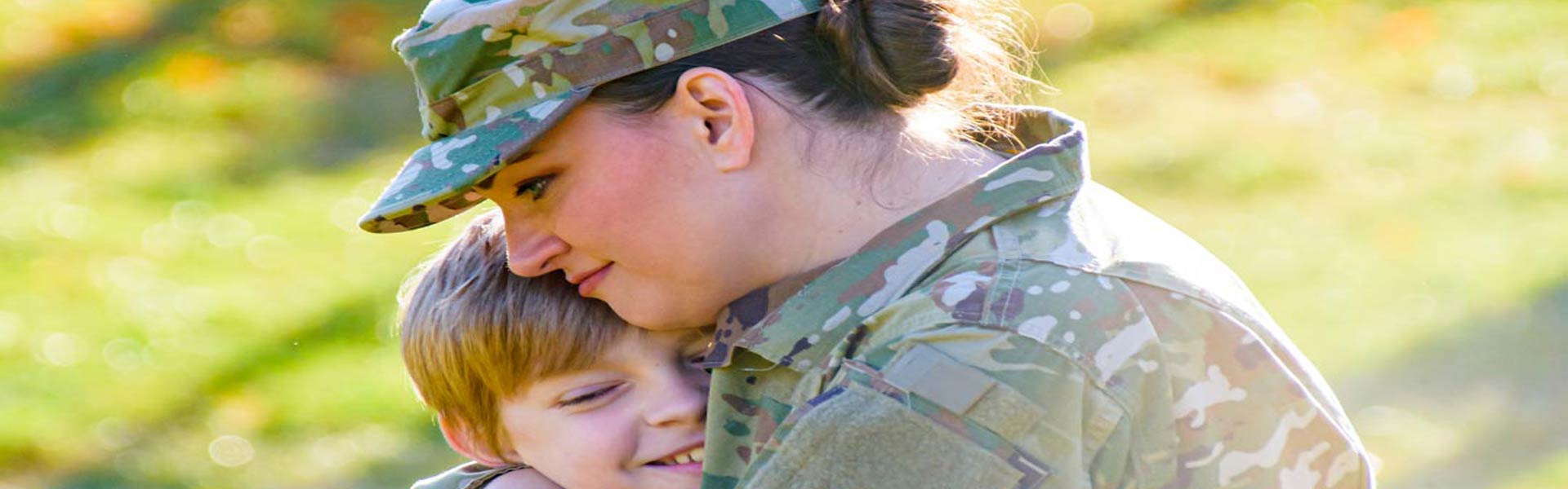 Military mom hugs son