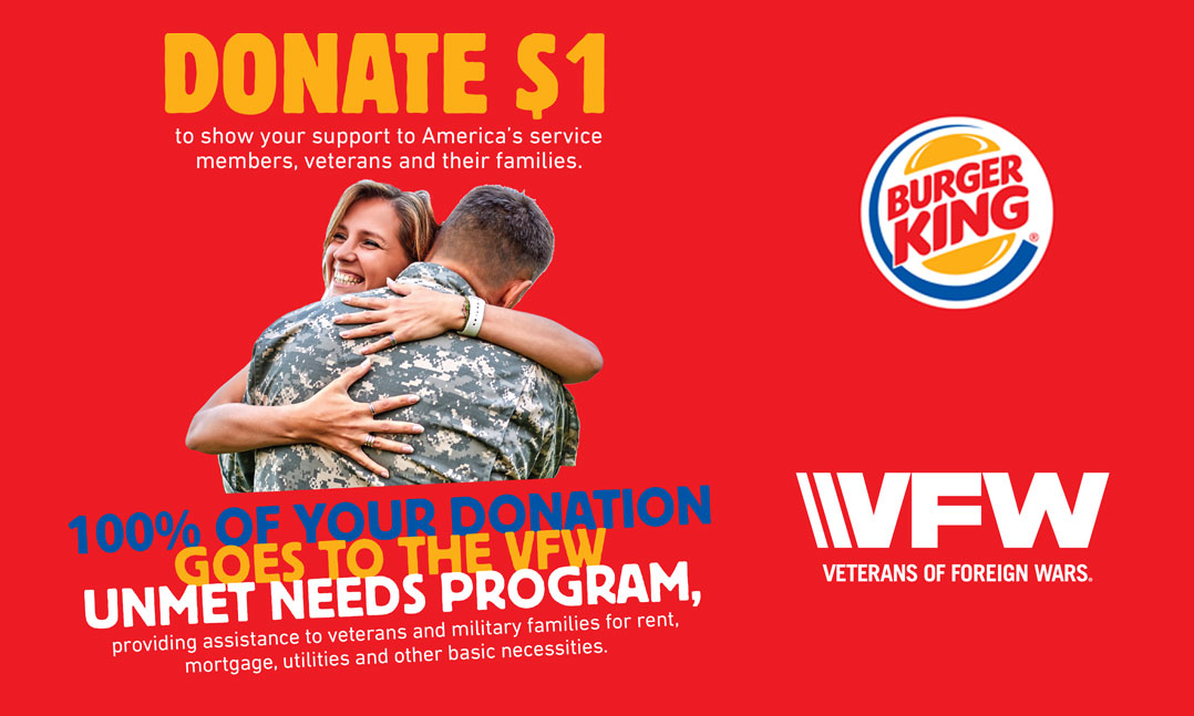 Soldier hugs his wife Burger King raises money for VFW