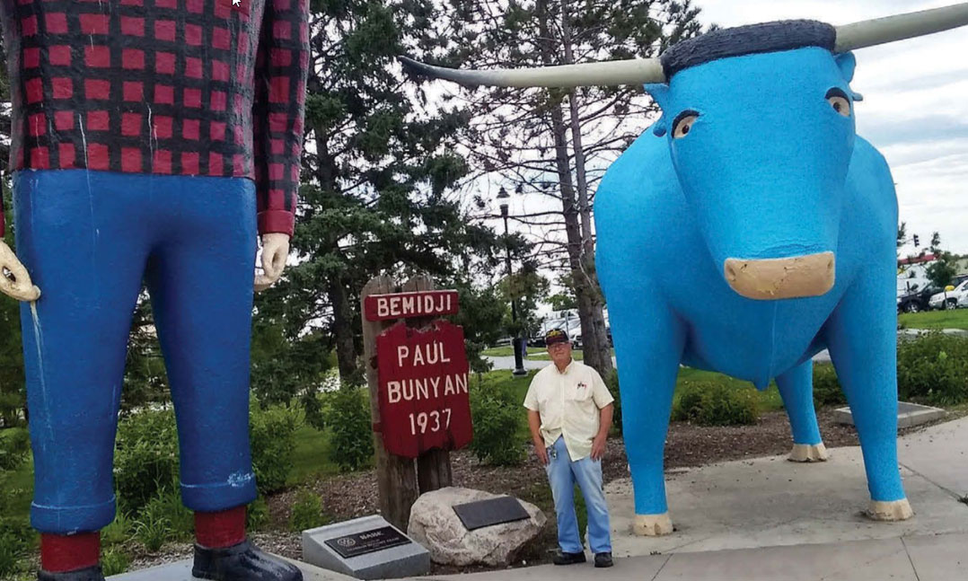 Vietnam veteran Howard Jenkis admires the Paul Bunyan and Babe the Blue Ox monument in Bemidji, Minnesota