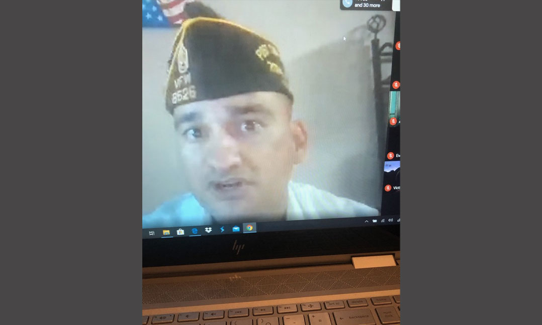 Leaders of VFW Post 8526 leads a Zoom meeting to teach lessons on service