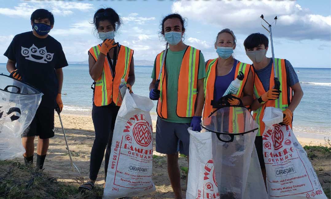 Young locals help clean up a Maui beach