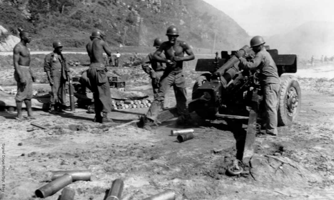 American troops blasting Yongdok with their 105-mm howitzer