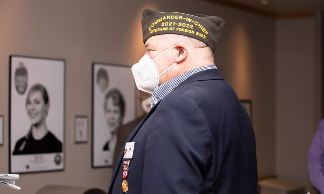 National Commander Fritz Mihelcic views the VA-sponsored 'Through Our Eyes: The Women Veterans' Experience' exhibit