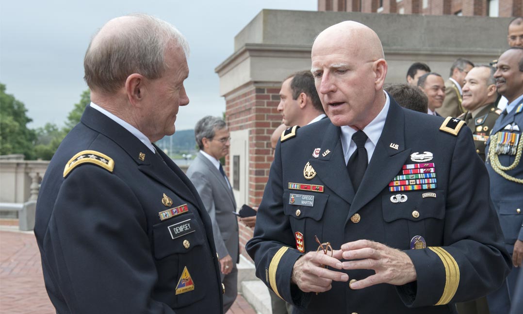 Army Maj. Gen. Gregg Martin, right, then-president of National Defense University on Fort McNair, talks to then-Chairman of the Joint Chiefs of Staff, Army Gen. Martin Dempsey.
