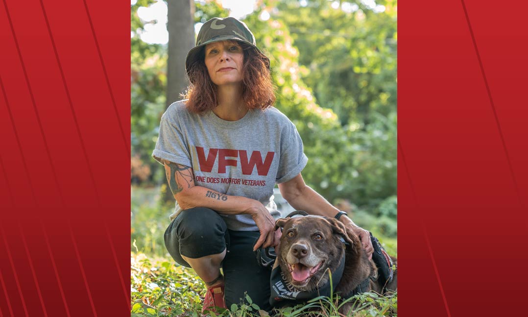 Army veteran Helyn Stowe pets her service dog, Astro, during a trail walk near her home in Staunton, Virginia.