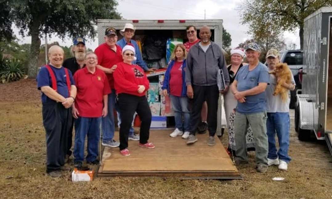 VFW South Carolina Commander Dwight Hora (fourth from the left) with the trailer loading crew at the SC state headquarters