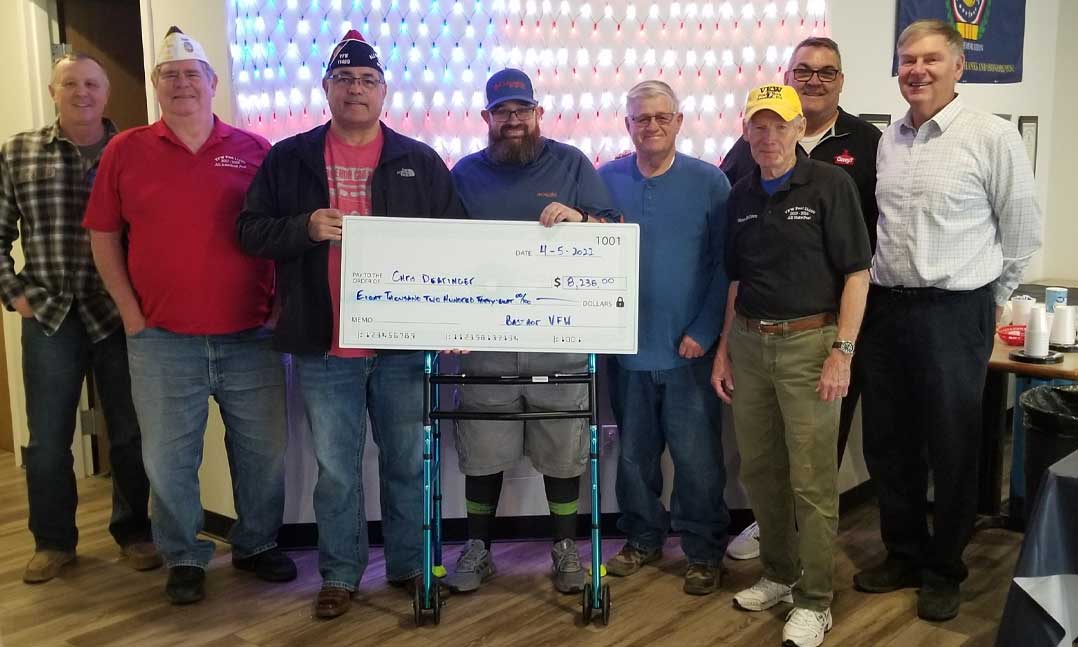 VFW Post 11499 presents a check to Chris Dearinger in April 2022