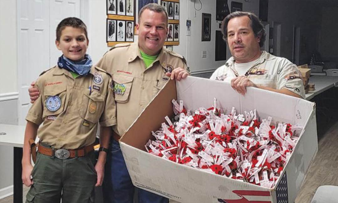 A Boy Scout unit displays a basket of Buddy Poppies at VFW Post 2423 in Indian Trail, North Carolina, in 2020.
