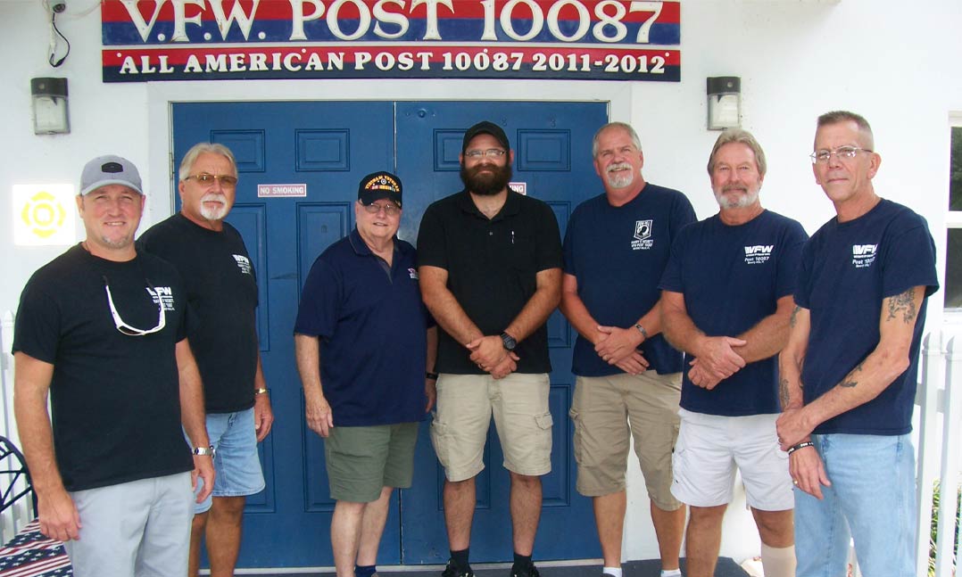 Members of VFW Post 10087 stand in front of the Post