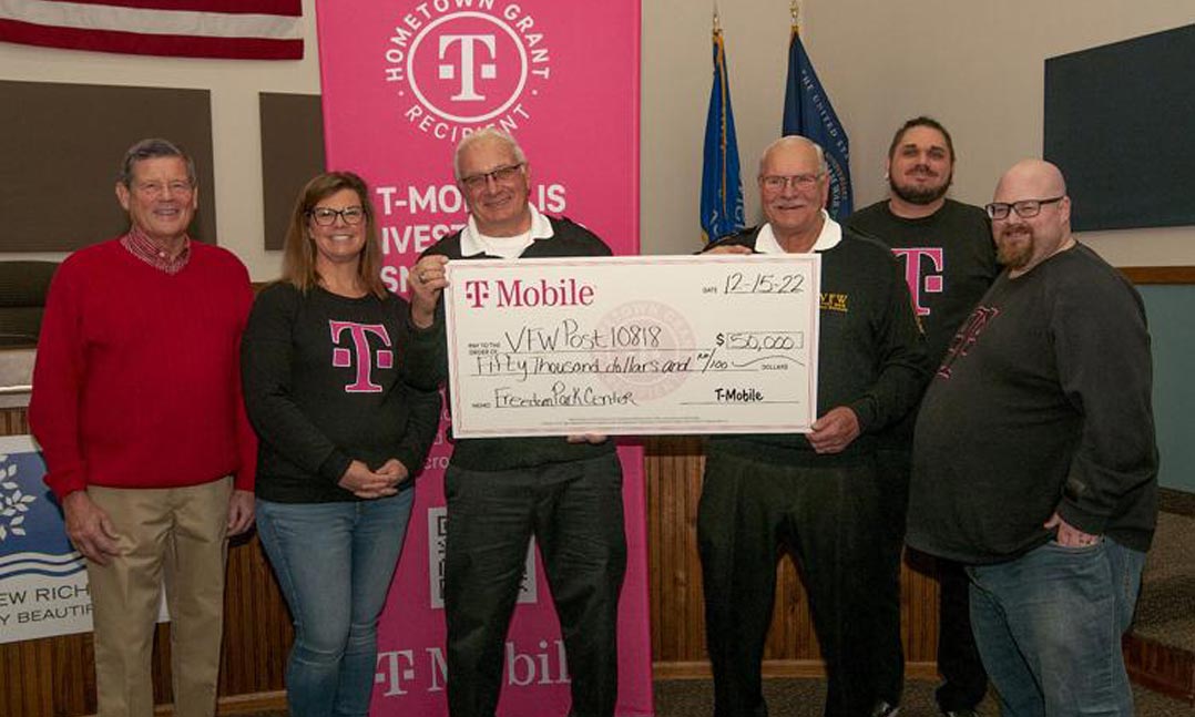 T-Mobile presents a $50,000 check to VFW Post 10818 in New Richmond, Wisconsin, for its Freedom Park Center.