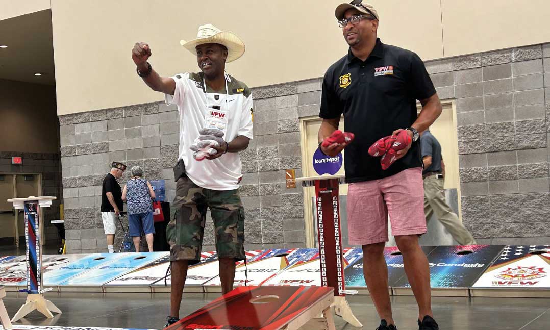 Two VFW members compete in a Cornhole tournament during VFW National Convention