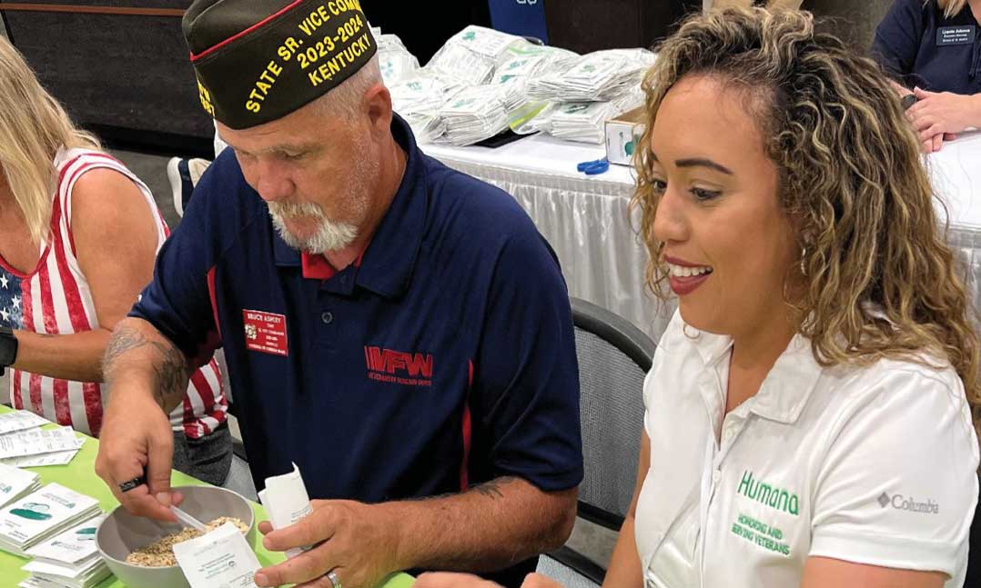 Volunteers pack seeds during VFW National Convention for Uniting to Combat Hunger