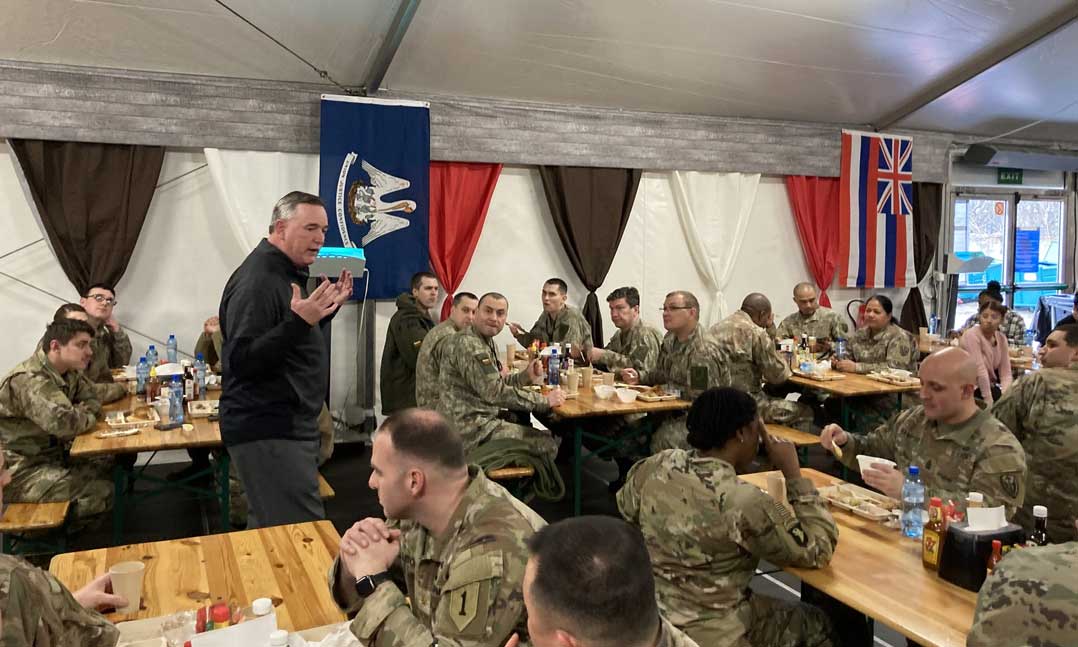VFW National Commander Tim Borland speaks with troops deployed to Poland
