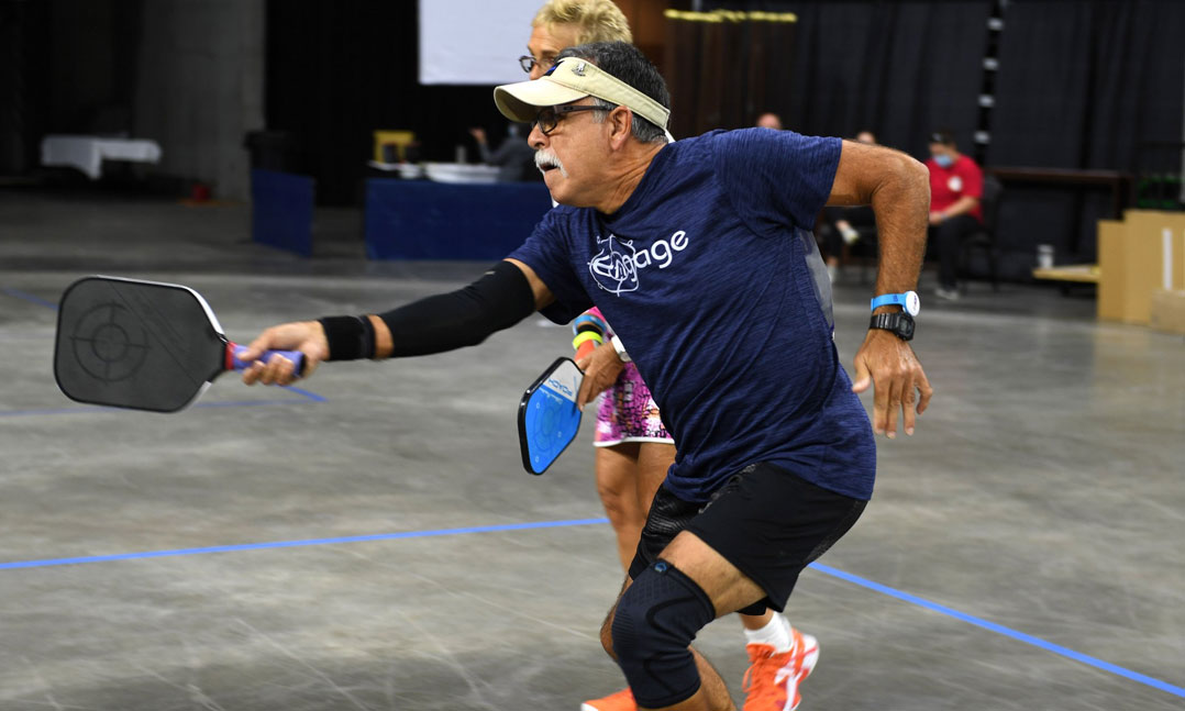 Nelson Gonzalez, a Life member of VFW Post 5277 in Clermont, Fla., returns a pickleball