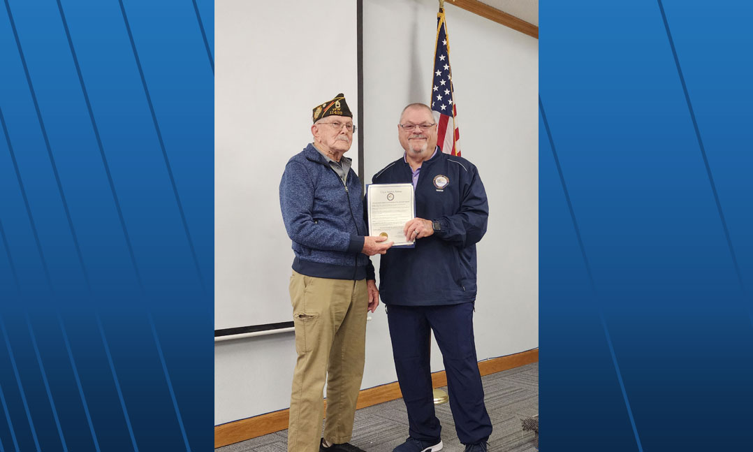 (From left to right) Army World War II veteran Wilbur Grisham on Jan. 23 receives a proclamation from Basehor, Kan., Mayor Dick Drennon that declares Jan. 23, 2023, as “Clyde Wilbur Grisham Day” in the town. Member of Post VFW Post 11499 in Basehor celebrated Grisham 100th birthday that day. Photo courtesy of David Babin.