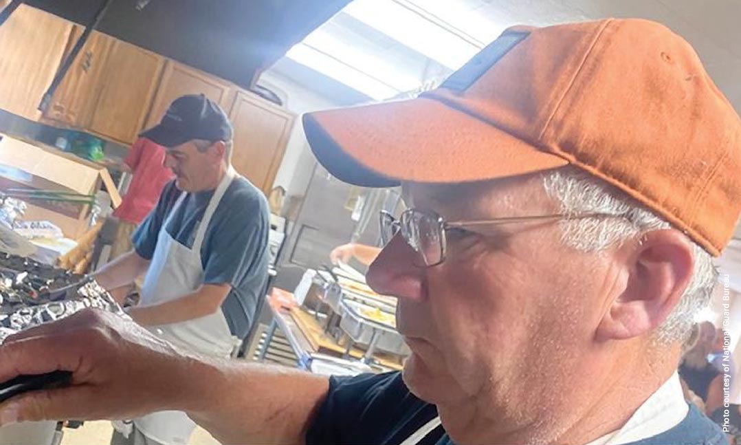 VFW members prepare a meal for a fundraiser for a child with a rare form of cancer