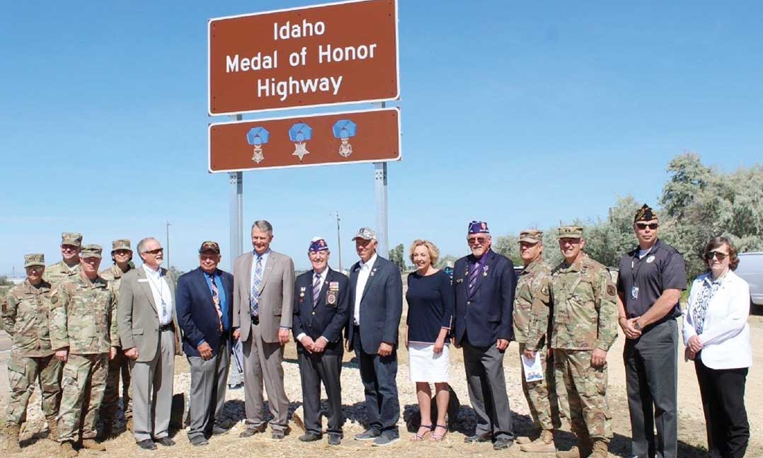 Military service members, veterans and politicians stand near the then-newly renamed Medal of Honor Highway on July 1, 2019, on Highway 20 in Caldwell, Idaho.