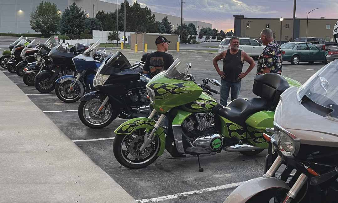 Members of the Victory Motorcycle Club gather during one of the many stops along their cross-country, V2V Relay ride