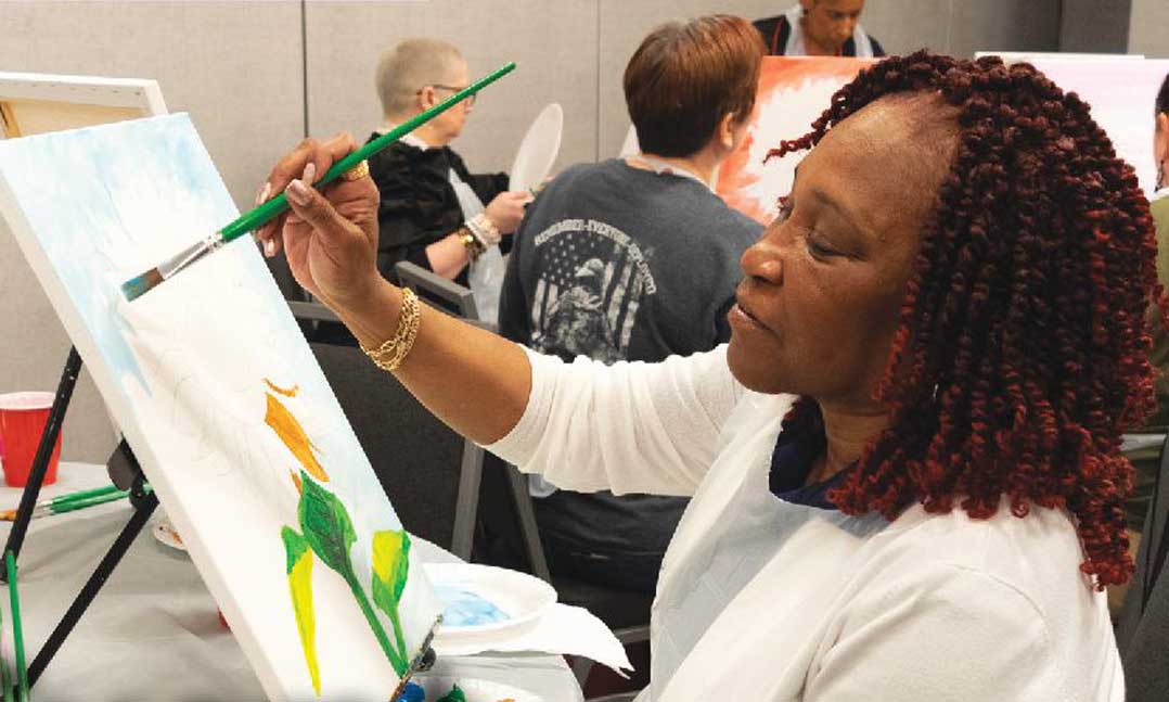 A member of the VFW Department of Pennsylvania’s Women Veterans Conference participates in a painting class