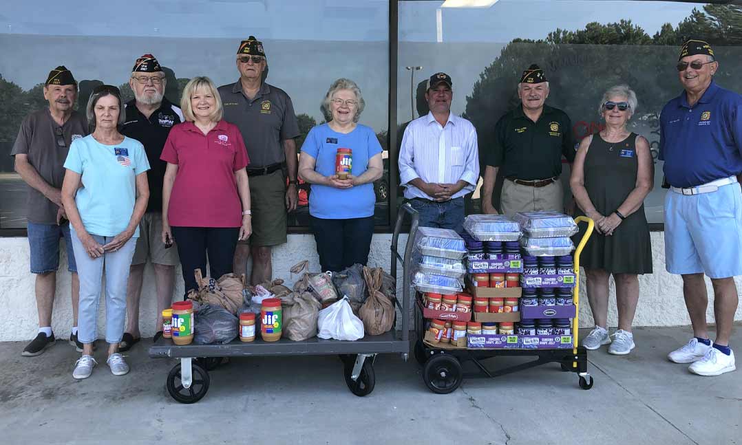 VFW Post and Auxiliary members donate food to local pantries