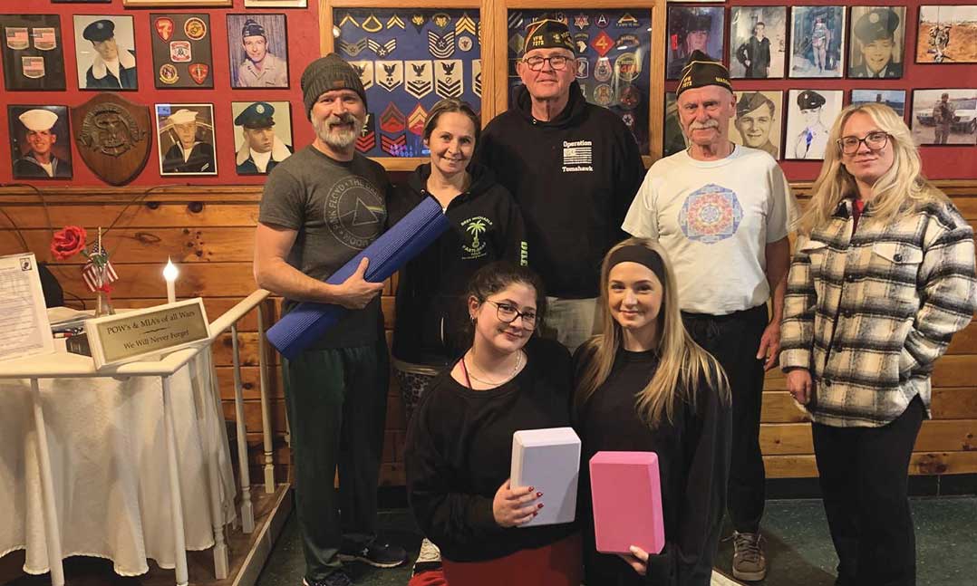 People gather after a yoga class at a VFW Post