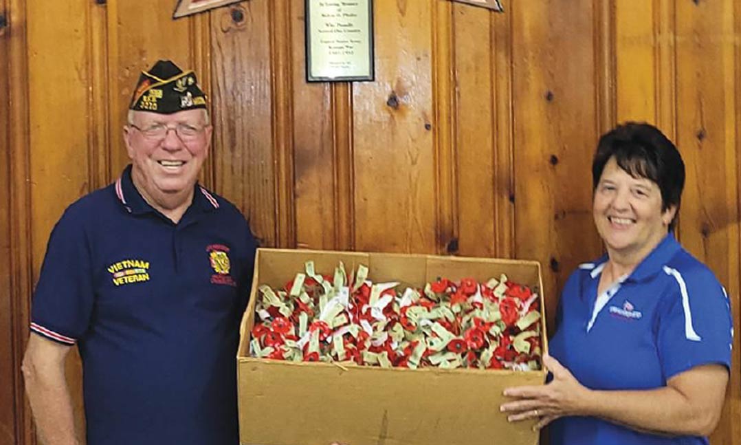 VFW Post 2210 Commander Dennis M. Grass and VFW Post 2210 Auxiliary Americanism Chairman Sharon Giesler