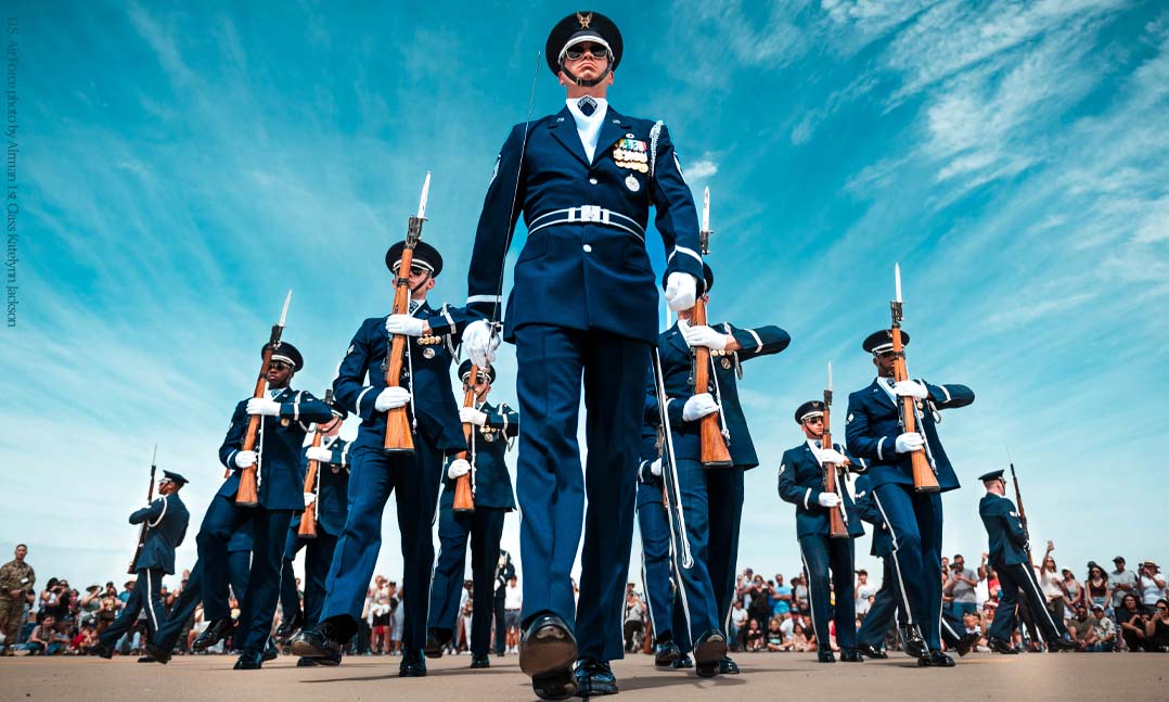 Members of the United States Air Force Drill Team march in formation