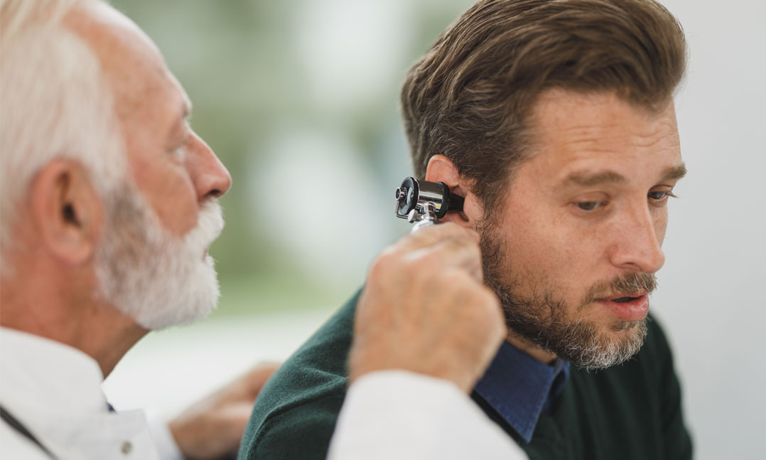 doctor tests mans hearing