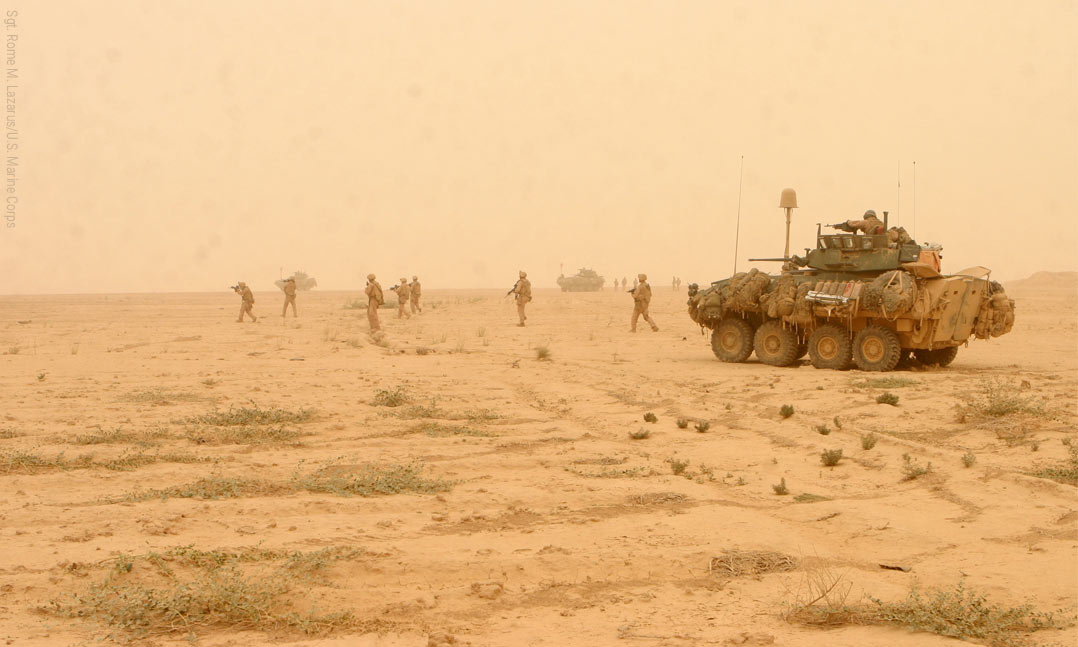 Tank rolls through the desert